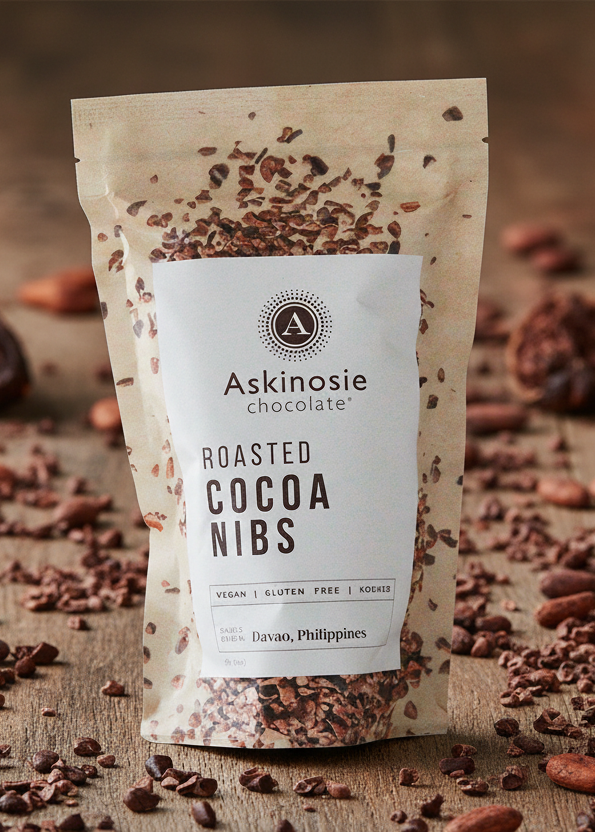 Package of Askinosie roasted cocoa nibs with a visible brand logo and text.