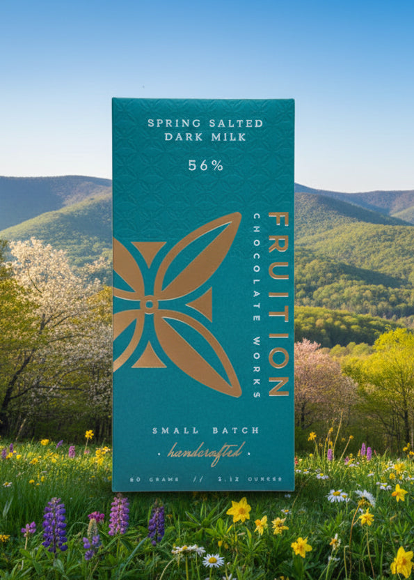Chocolate bar packaging with a scenic background of mountains and trees